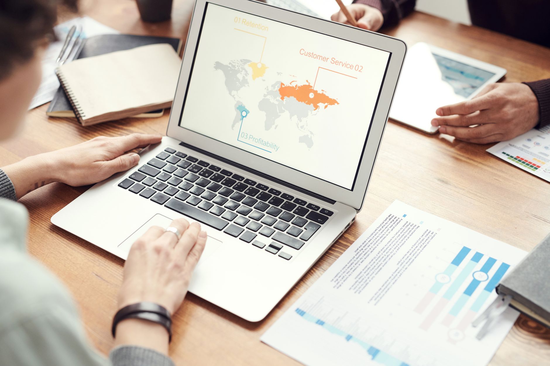 Team reviewing a business dashboard on a laptop during a working session